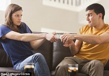 Couple fighting over tv remote