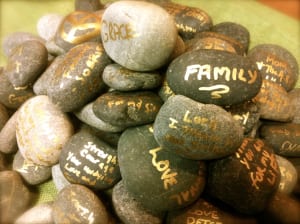 Pile of rocks with words on them like, family, love, grace, ect.