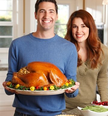 man holding thanksgiving turkey