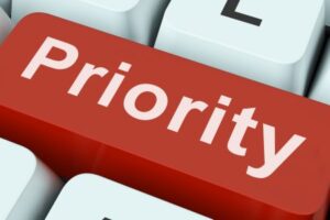 Keyboard key that says "Priority"