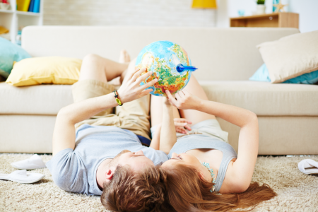 Couple looking at globe together