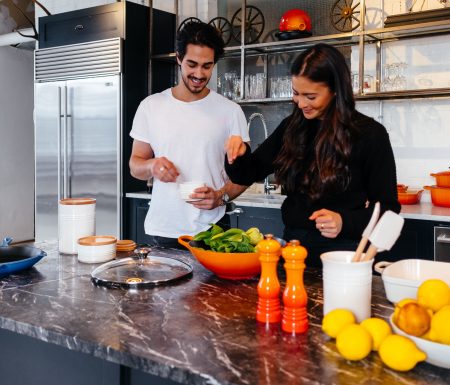 Couple making a salad in the kitchen