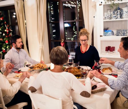 Family sharing a meal together at Christmas time